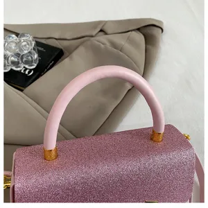 Detail view of pink glitter handbag, stylish Korean style square crossbody bag for women.