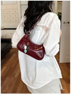Chic minimalist faux crocodile leather underarm shoulder bag for women, stylish daily wear.