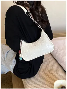 Chic white croc-embossed underarm shoulder bag with metal chain strap and cute charm.