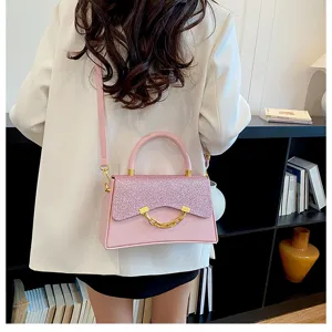 Stylish pink shoulder bag with glitter flap and chic chain detail for modern women daily use.