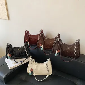 Trendy crocodile pattern women underarm shoulder bag with metal chain and cute charms.