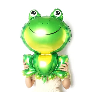 Close-up detail shot of a large green frog foil balloon, perfect for kids party decor.