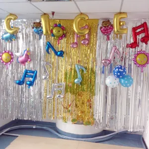 Fringe foil curtain and colorful party balloons background decoration scene detail display