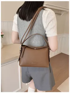 Women brown leather shoulder bag stylish casual crossbody handbag daily commuting tote purse.