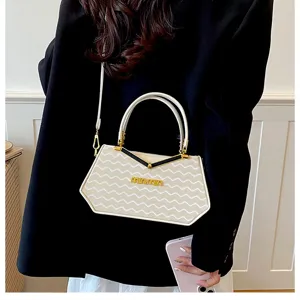 Borsa a mano trapezoidale chic dal design di nicchia da donna, borsa a tracolla alla moda.