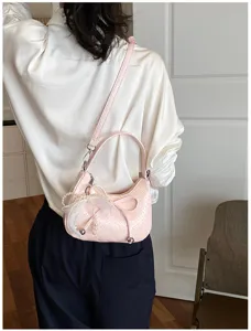 Pink woven crescent shoulder bag with pearl bow, chic fashion elegant armpit handbag for women.