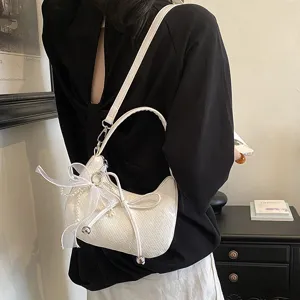 French woven crescent shoulder bag with bow pearl decor, chic minimalist underarm bag for women.