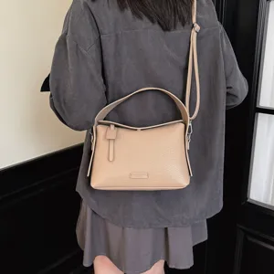 Women's fashion shoulder crossbody bag, casual pebbled leather handbag with handle.