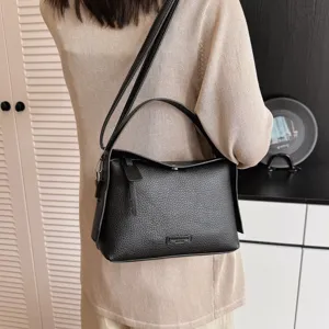 Black textured leather women shoulder crossbody bag, minimalist casual handbag for daily wear.