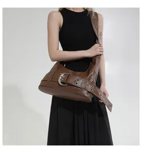 Vintage brown leather shoulder bag with bold metal buckle detail for daily commute and street style.