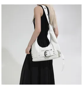 Vintage white underarm shoulder bag with large metal buckle, stylish motorcycle commuter tote.