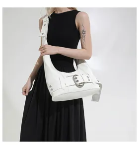 Detail shot of white leather hobo shoulder bag with stylish metal buckle and strap.