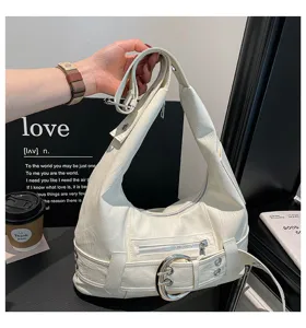 Detailed view of the white PU leather slouchy shoulder bag with metallic buckle hardware.
