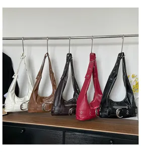 Detailed view of multi-color retro motorcycle hobo shoulder bags with stylish buckle straps.