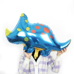 Blue triceratops dinosaur foil balloon, cute party decoration for kids birthday celebration.
