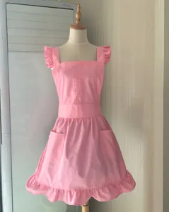 Korean style solid color pink apron with ruffles and pockets for salon and cafe work detail view