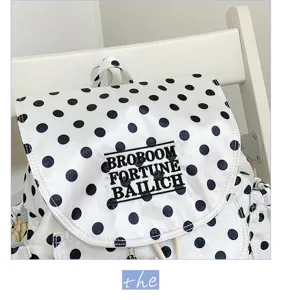 Black and white polka dot backpack casual fashion school bag with flap and embroidery.