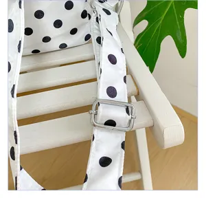 Polka dot backpack detail shot showing adjustable strap and metal hardware for casual bags.