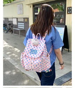 Pink polka dot backpack casual canvas school bag with cute plush dog pendant for daily use
