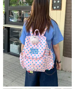 Pink polka dot backpack for women casual stylish school bag with cute doll pendant daily use