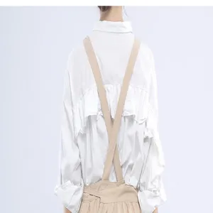 Detail view of Japanese style cotton linen cross back apron, breathable fabric, back strap design.
