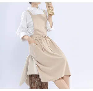 Japanese style cotton linen apron in beige with cross back and pockets for baking floral arts.