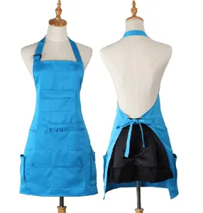 Detailed view of blue kitchen apron with multiple utility pockets and adjustable neck strap.