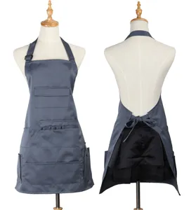Grey multi-pocket work apron detail showcasing front and back functional pocket design.