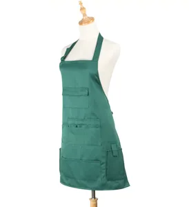 Dark green halter apron with pockets, professional workwear for cafe and restaurant staff.