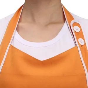 Korean style fashion work apron for cafe salon service, orange and white design with buttons.