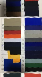 Fabric color swatch card displaying multiple available shades for custom work aprons and uniforms.