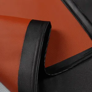 Durable waterproof PVC apron material in bright orange with reinforced black edges for kitchen work.