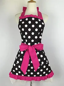 Vintage black and white polka dot cotton apron with pink bow and ruffle hem details.