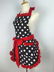 Retro black white polka dot ruffle apron with red bow, side view mannequin display.