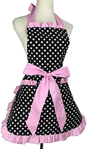 Detailed view of the black and white polka dot apron featuring pink ruffles and waist bow.