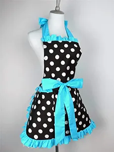 Vintage black and white polka dot apron featuring bright blue ruffles and a large bow.