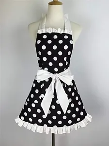 Retro black and white polka dot apron with white ruffle hem and big bow waist detail.