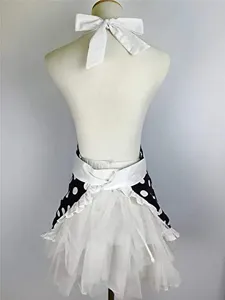 Detailed view of the retro polka dot maid apron featuring a white tulle skirt and bow.