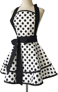 Vintage black and white polka dot apron featuring halter neck and big bow for women.