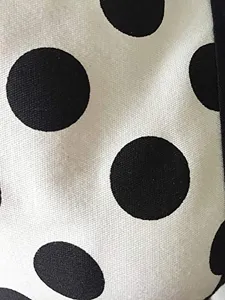 Black and white polka dot fabric close-up detail for the vintage cotton apron