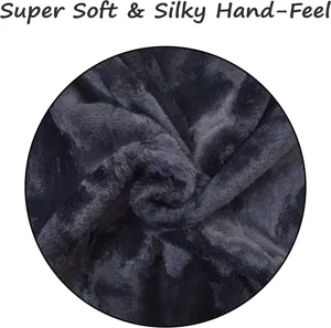 Close-up detail of dark grey faux rabbit fur cushion fabric showing ultra-soft and silky texture.