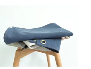 Vintage heavy canvas apron with metal grommets and multi pockets for barbers and baristas.