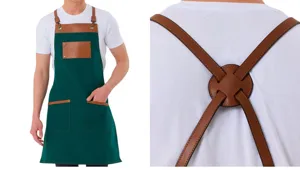 Green canvas work apron with brown leather straps, pockets for kitchen cooking coffee shop BBQ