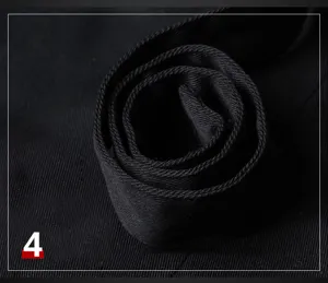 Black apron fabric and strap detail shot showing durable texture for daily work use.