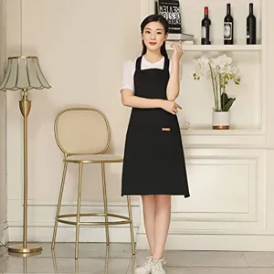 Black work apron with cross back straps, durable fabric, ideal for kitchen, cafe and restaurant.