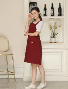 Adjustable cross strap cotton apron with pocket for coffee shop kitchen workwear utility.