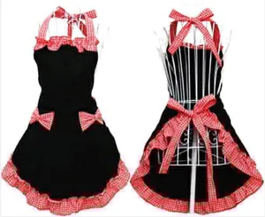 Black maid apron with red checkered bows and double ruffled hem, adjustable neck.