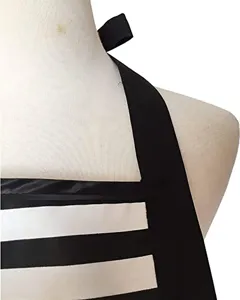 Black and white striped halter apron with adjustable strap and cute bow detail for cooking.