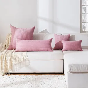 Pink corduroy long body pillow and cushion set with striped texture for sofa decor detail view.