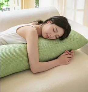 Detailed scene of a soft green cooling body pillow for side sleeping, cozy and comfortable.